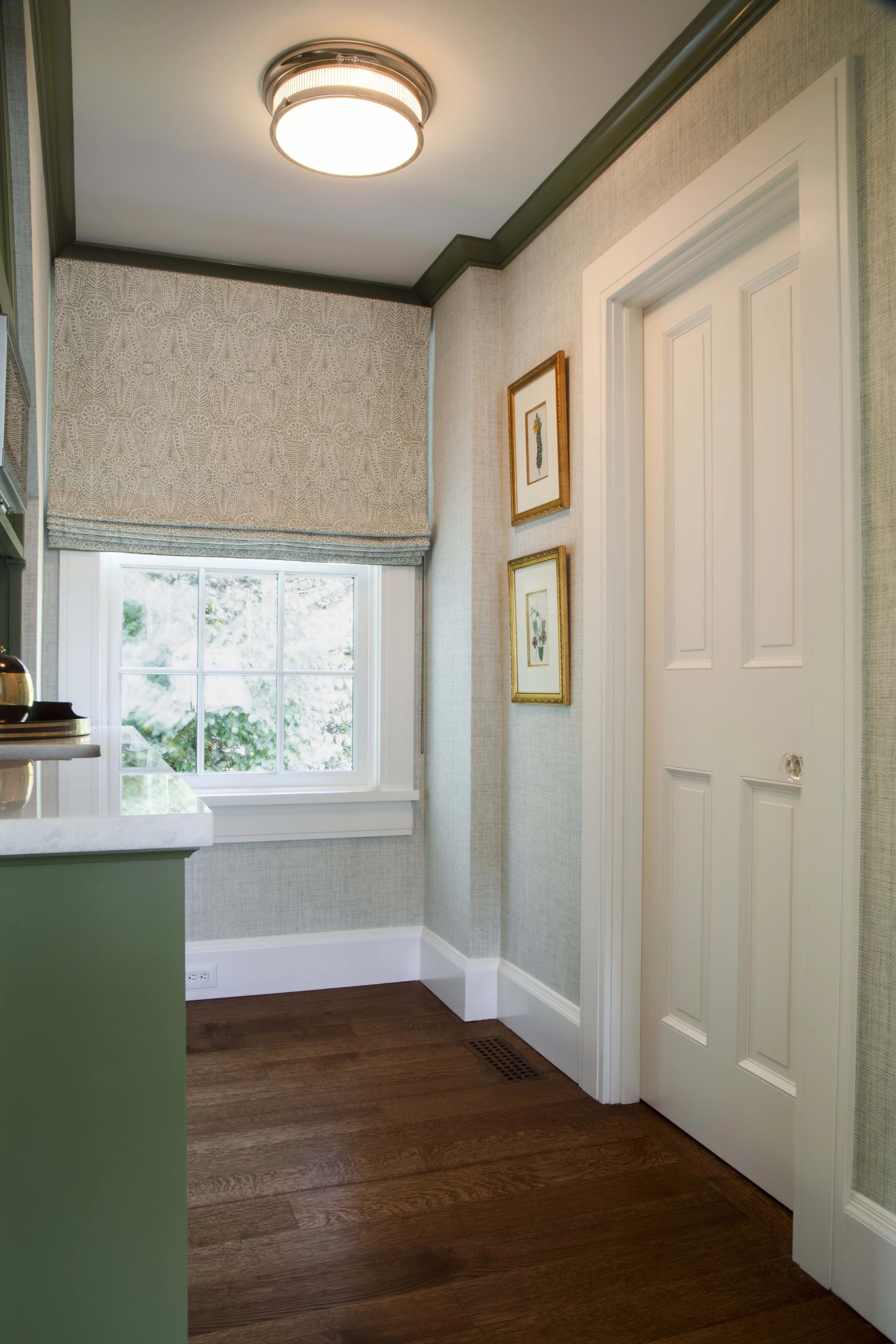 Corner detail with green trim and botanical prints