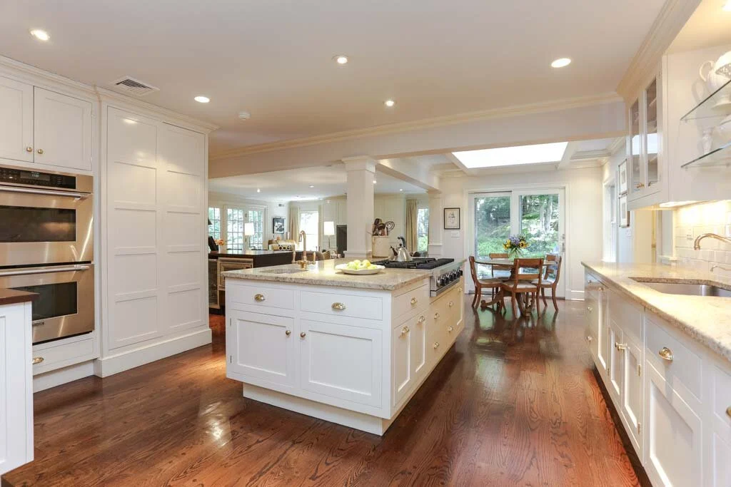 Bright kitchen with white cabinets and central island