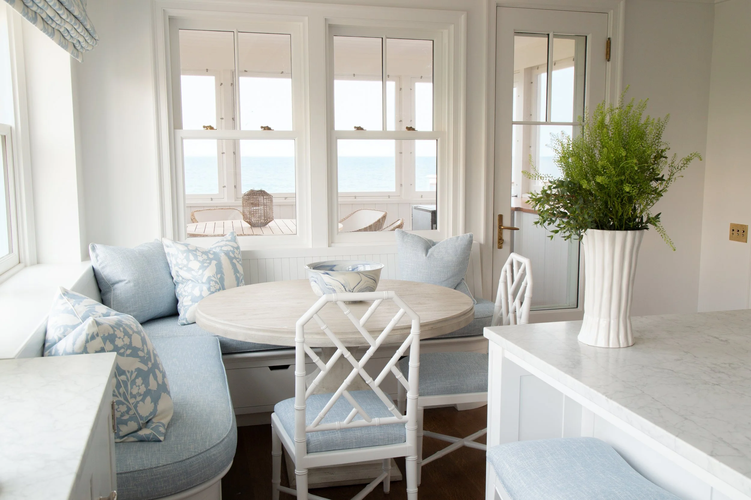 Dining nook with round table and ocean views