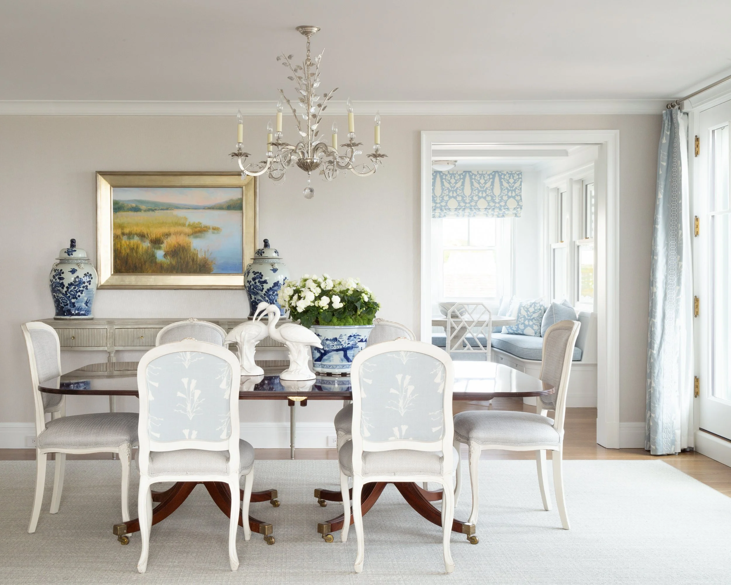 Dining room with chandelier and blue-and-white vases